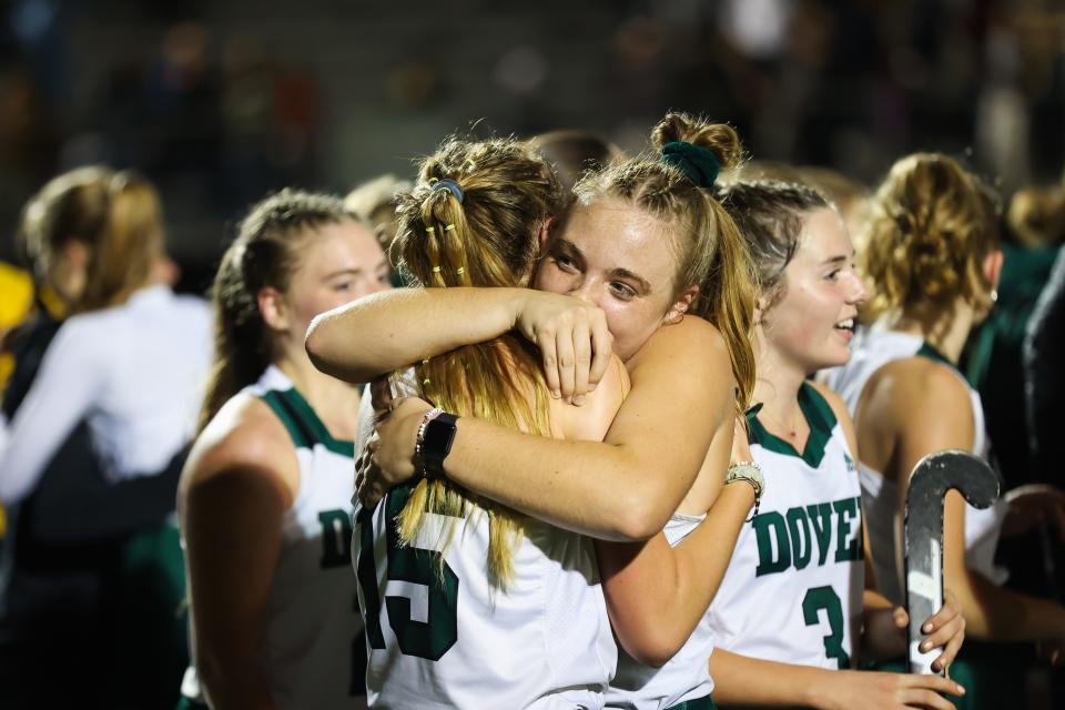 Dover's Audrey Carter embraces teammate Rylen Gray after Tuesday's 2-0 win over Exeter in a Division I semifinal at Exeter High School. The top-seeded Green Wave will face No. 2 Windham on Sunday in the championship game at Exeter High School.