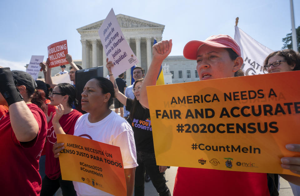 FILE - In this June 27, 2019, file photo, Demonstrators gather at the Supreme Court as the justices finish the term with key decisions on gerrymandering and a census case involving an attempt by the Trump administration to ask everyone about their citizenship status in the 2020 census, on Capitol Hill in Washington. The Justice Department said Tuesday that the 2020 Census is moving ahead without a question about citizenship. (AP Photo/J. Scott Applewhite, File)