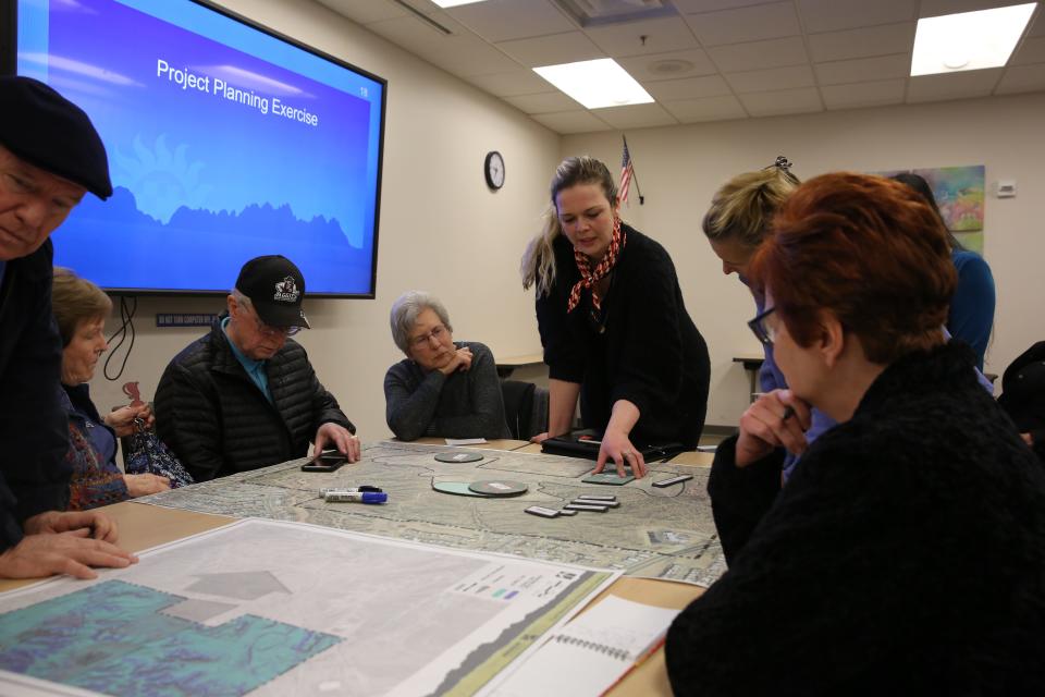 Landscape architect Norma Oder helps attendees lay out where they ideally want fields and sport courts to go at an East Mesa Public Recreation Complex public meeting Jan. 30, 2020.