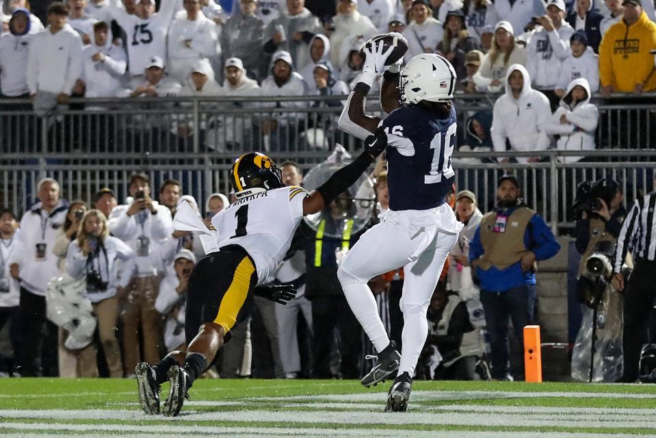 Sep 23, 2023; University Park, Pennsylvania, USA; Penn State Nittany Lions tight end Khalil Dinkins (16) makes a catch in the end zone for a touchdown during the second quarter against the Iowa Hawkeyes at Beaver Stadium. Mandatory Credit: Matthew O'Haren-USA TODAY Sports