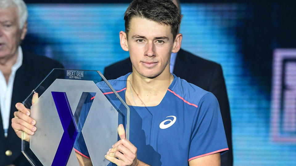 Australia’s Alex De Minaur poses with his trophy after losing to Greece’s Stefanos Tsitsipas during the men’s final of the Next Generation ATP Finals in Milan on November 10, 2018. (Photo by Miguel MEDINA / AFP)