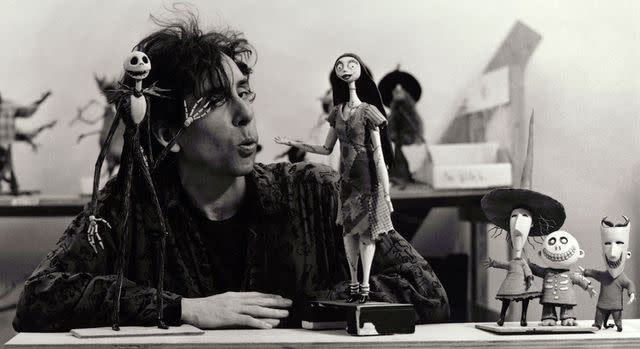 <p>Elizabeth Aninas/Touchstone/Kobal/Shutterstock</p> Tim Burton posing with characters from 1993's 'The Nightmare Before Christmas'