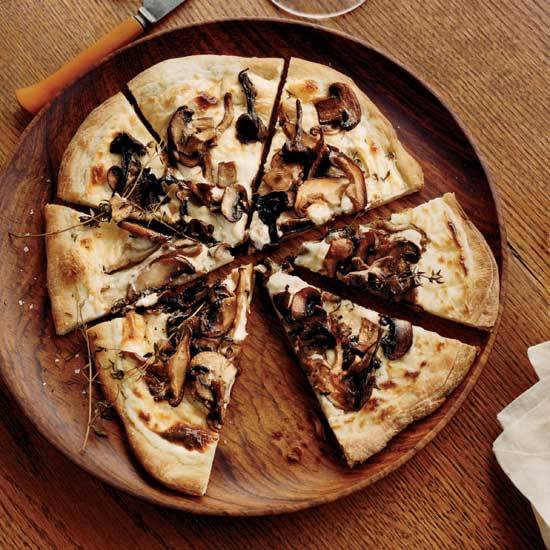 Mushroom-and–Goat Cheese Béchamel Pizzas To give these individual pizzas an extra-luxe topping, Andres Barrera makes a velvety béchamel sauce with goat cheese and freshly grated nutmeg, then adds dollops of sautéed mushrooms. Get the Mushroom-and–Goat Cheese Béchamel Pizza recipe.