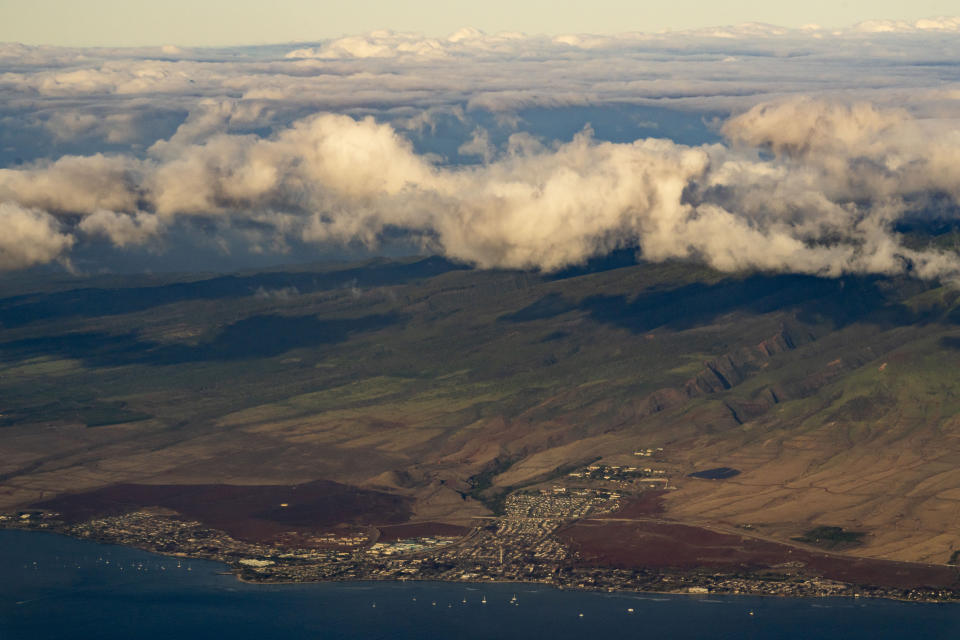 The town of Lahaina is pictured Tuesday, Dec. 5, 2023, in Hawaii. The heart of Lahaina, the historic Maui town that burned in a deadly Aug. 8 wildfire that killed at least 100 people, reopened Monday, Dec. 11, to residents and business owners who hold a day pass. (AP Photo/Lindsey Wasson)