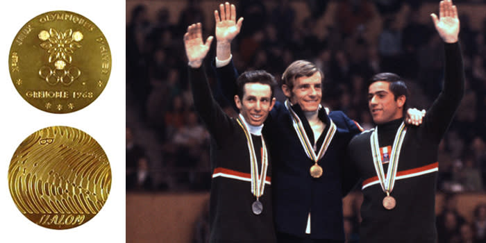 <p>The medals for the 1968 X Olympic Winter Games were the first-ever Olympic medals made for each sport discipline.<br>(IOC photo; French gold medalist Jean-Claude Killy, with Austrians Herbert Huber and Alfred Matt in Grenoble, France./Photo by IOC Olympic Museum/Allsport) </p>