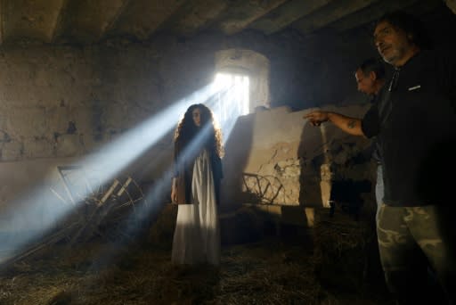 A film crew shoot a scene on the set of an Israeli television series inside the Beit Jamal monastery near the central city of Bet Shemesh, west of Jerusalem
