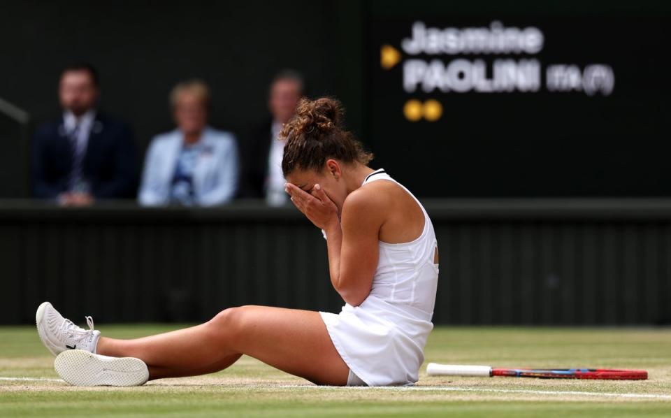 Paolini slumps to the floor after losing a point in a riveting final (Getty)