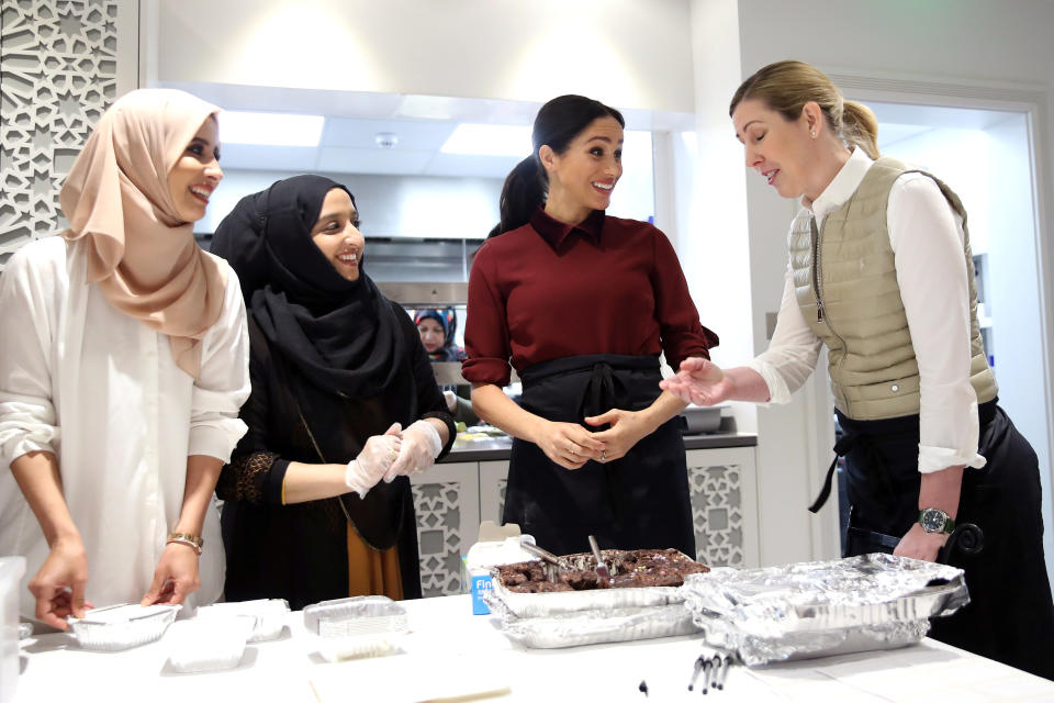 Britain's Meghan, Duchess of Sussex talks to chef Clare Smyth as she visits the Hubb Community Kitchen to see how funds raised by the 'Together: Our Community' cookbook are making a difference at Al Manaar, in London, Britain, November 21, 2018. Chris Jackson/Pool via REUTERS