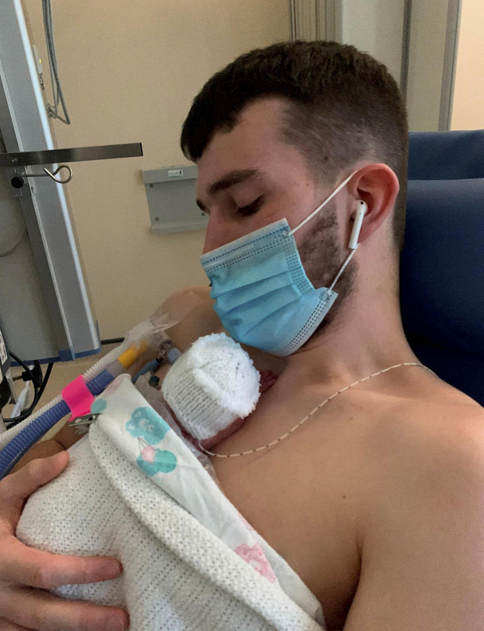 Brandon Stibbles holding Hannah Stibbles. See SWNS story SWSCbaby. The parents of Britain's smallest ever premature baby told of their joy after they got to hold her - and are reading her stories. Baby Hannah Stibbles is now a month old, and was born on December 30 by emergency C-section at 25 weeks. Tiny Hannah, who weighed just 325g (11oz) at birth, is thought to be the smallest baby ever to survive in the UK and was given a 20 per cent chance of pulling through by doctors. Parents Ellie Paton, 17, and Brandon Stibbles, 21, have finally been able to hold the tot, who will stay in the Queen Elizabeth University Hospital, in Glasgow, until she is big enough to go home. (Brandon Stibbles/SWNS)