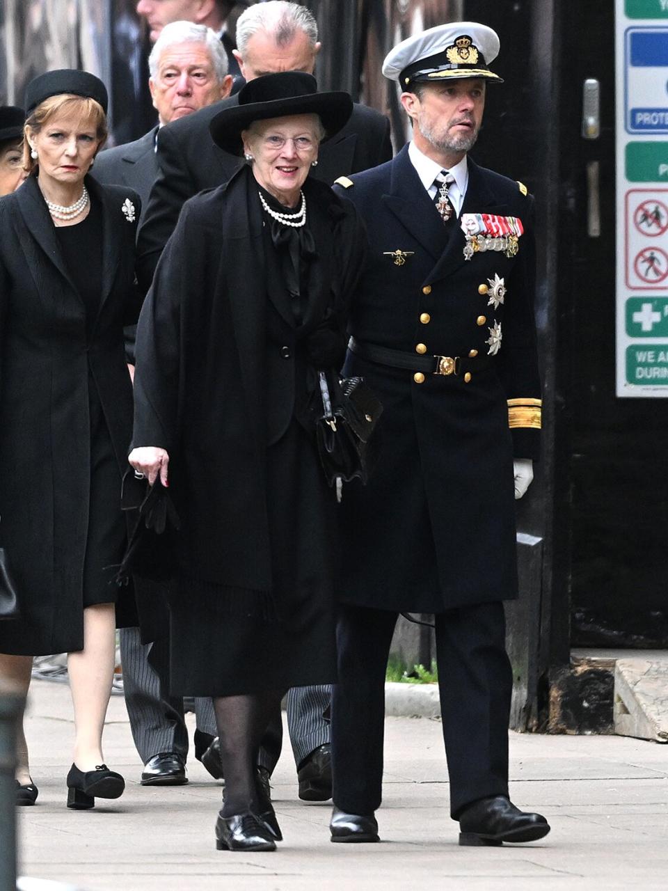 Margrethe II of Denmark and Frederik, Crown Prince of Denmark arrive for the State Funeral of Queen Elizabeth II at Westminster Abbey on September 19, 2022 in London, England.