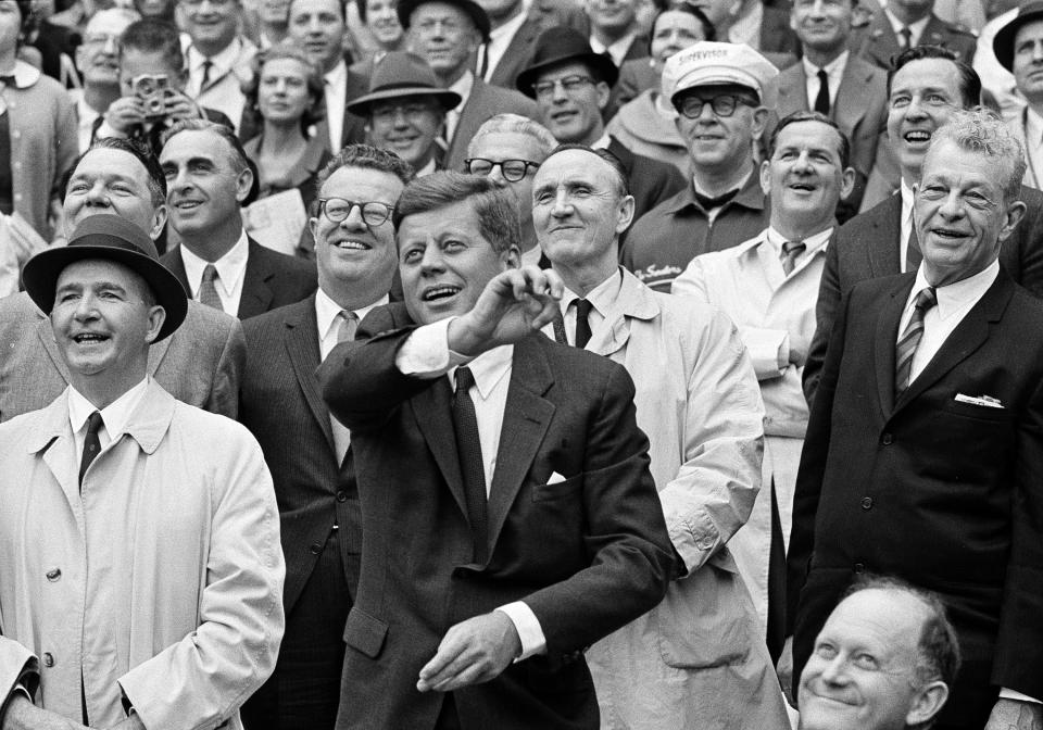 FILE - IN this April 9, 1962, file photo, President John F. Kennedy throws out the first pitch to inaugurate the 1962 American League baseball season and DC Stadium in Washington. (AP Photo/File)