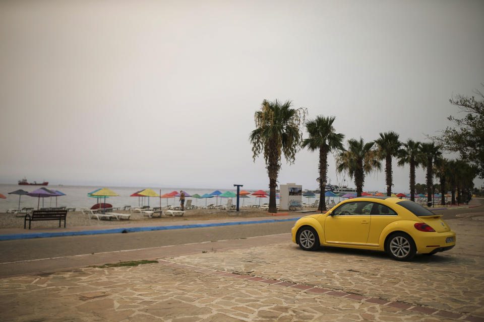 The Oren beach near the Kemerkoy Power Plant, a coal-fueled power plant, in Milas, Mugla in southwest Turkey, Thursday, Aug. 5, 2021. A wildfire that reached the compound of a coal-fueled power plant in southwest Turkey and forced evacuations by boats and cars, was contained on Thursday after raging for some 11 hours, officials and media reports said. (AP Photo/Emre Tazegul)