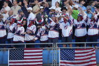 United States golf fans The marshals of the cup from Minnesota , applaud as their team arrives for their morning Foursomes match at the Ryder Cup golf tournament at the Marco Simone Golf Club in Guidonia Montecelio, Italy, Saturday, Sept. 30, 2023. (AP Photo/Andrew Medichini)