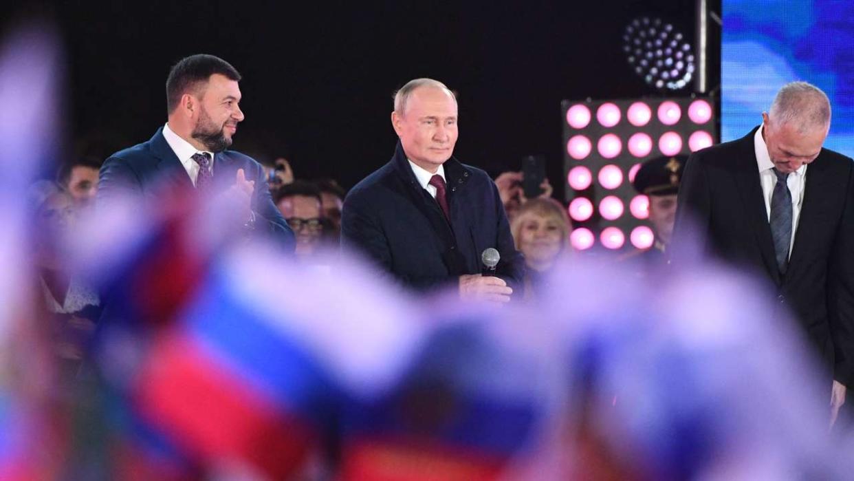 Russian President Vladimir Putin (C) addresses a rally and a concert marking the annexation of four regions of Ukraine Russian troops occupy - Lugansk, Donetsk, Kherson and Zaporizhzhia, at Red Square in central Moscow on September 30, 2022. (Photo by Maksim BLINOV / SPUTNIK / AFP)