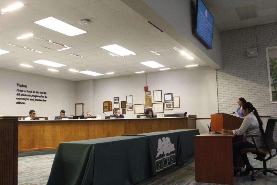 Mayra Calderon, a mother of three kids who attend Savannah-Chatham schools, speaks in front of the school board. Calderon recounts language barrier issues she's experienced with Rice Creek Elementary.  June 7, 2023.