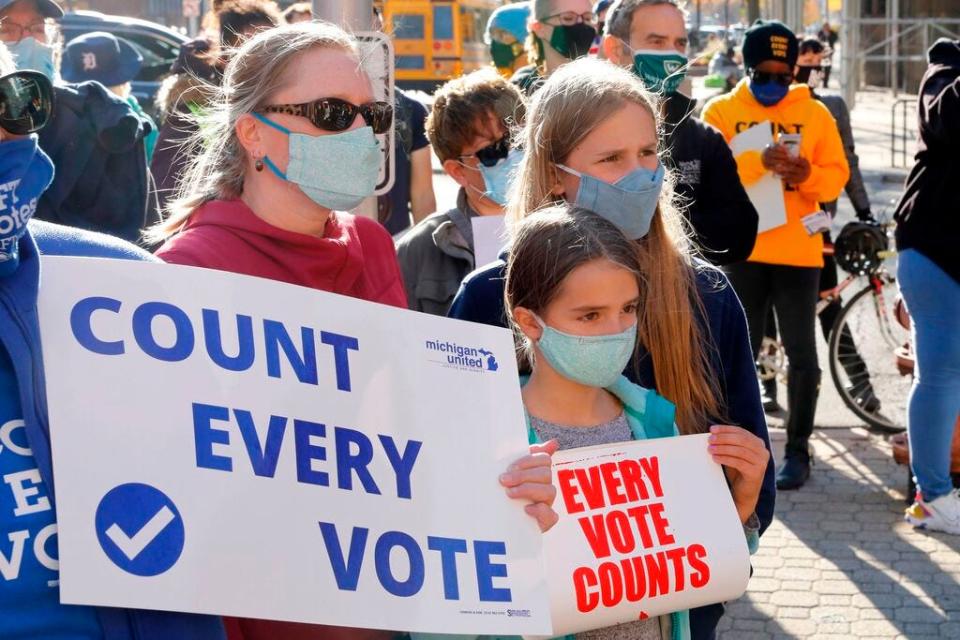 Protesters at a Nov. 4 rally in Detroit show their concern that every vote counted from the 2020 Presidential election.