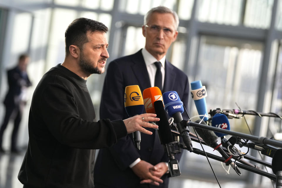 Ukraine's President Volodymyr Zelenskyy, left, speaks during a media conference with NATO Secretary General Jens Stoltenberg prior to a meeting of NATO defense ministers at NATO headquarters in Brussels, Wednesday, Oct. 11, 2023. (AP Photo/Virginia Mayo)