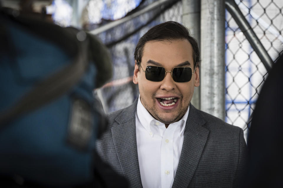 Rep. George Santos, R-N.Y., walks past the criminal courthouse at 100 Center Street in New York on Tuesday, April 4, 2023. Former President Donald Trump, who faces multiple election-related investigations, will surrender and be arraigned at the court Tuesday on criminal charges stemming from 2016 hush money payments. (AP Photo/Stefan Jeremiah)