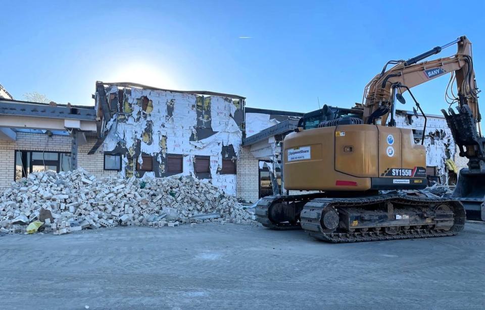 Demolition crews started tearing down the brick facade of the former K&W Cafeteria at University Place mall on Estes Drive in March 2024. The building will be replaced with a Chick-fil-A restaurant with two drive-through lanes.