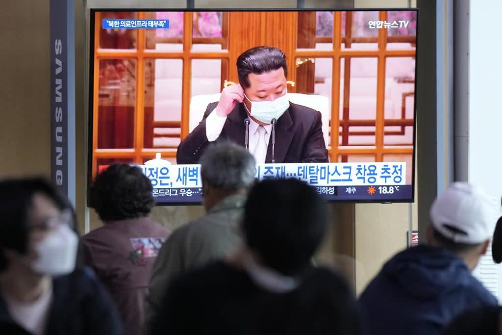 People watch a TV screen showing a file image of North Korean leader Kim Jong Un during a news program at a train station in Seoul, South Korea (Associated Press)