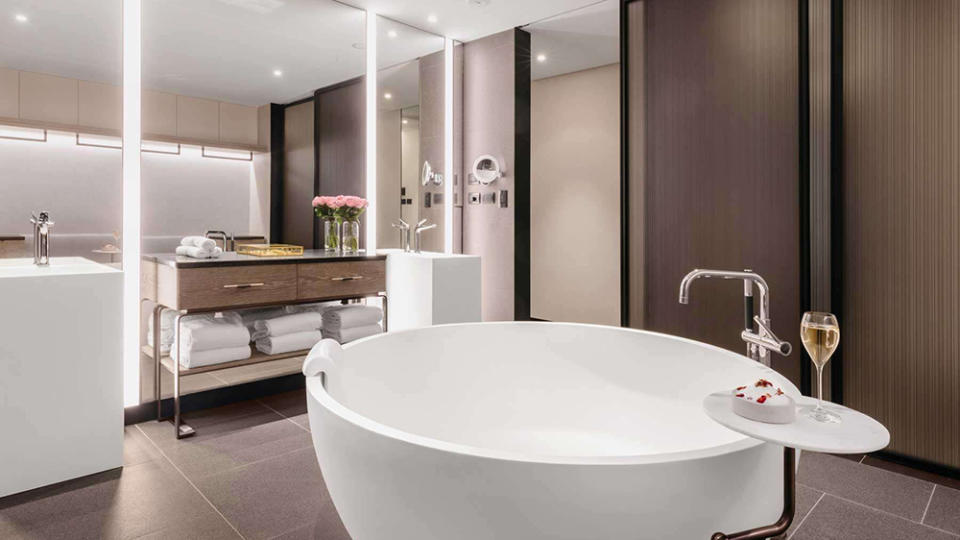 A bathroom with tub - Credit: Langham Hospitality Group