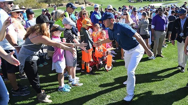 Jordan Spieth high-fives some excited kids. Pic: Getty