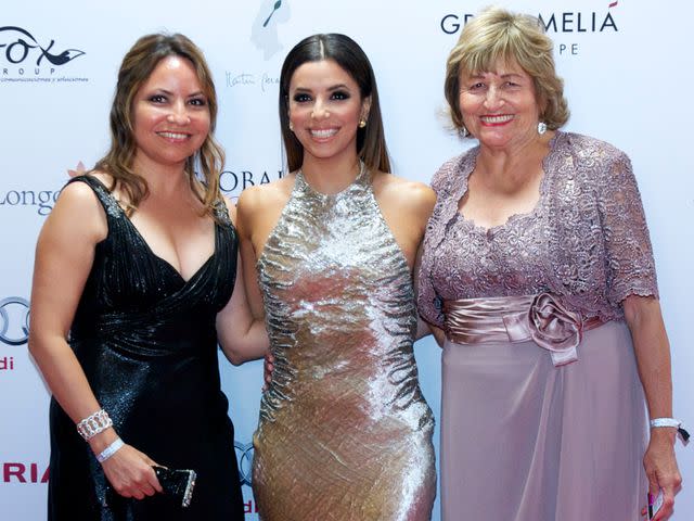 <p>Juan Naharro Gimenez/Getty </p> Eva Longoria with her mother Ella Eva Mireles and sister Emily attend the Global Gift Gala in 2014.