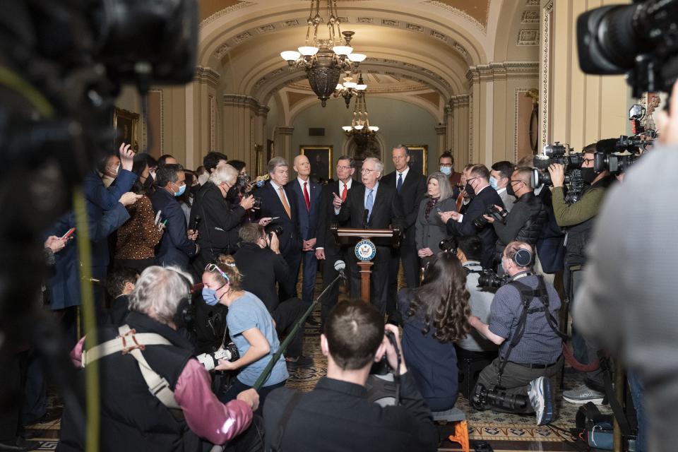 Senate Minority Leader Sen. Mitch McConnell, R-Ky., center, with members of the Republican leadership, calls on a reporter during a news conference after their weekly policy luncheon, Tuesday, Nov. 30, 2021, on Capitol Hill in Washington. (AP Photo/Jacquelyn Martin)