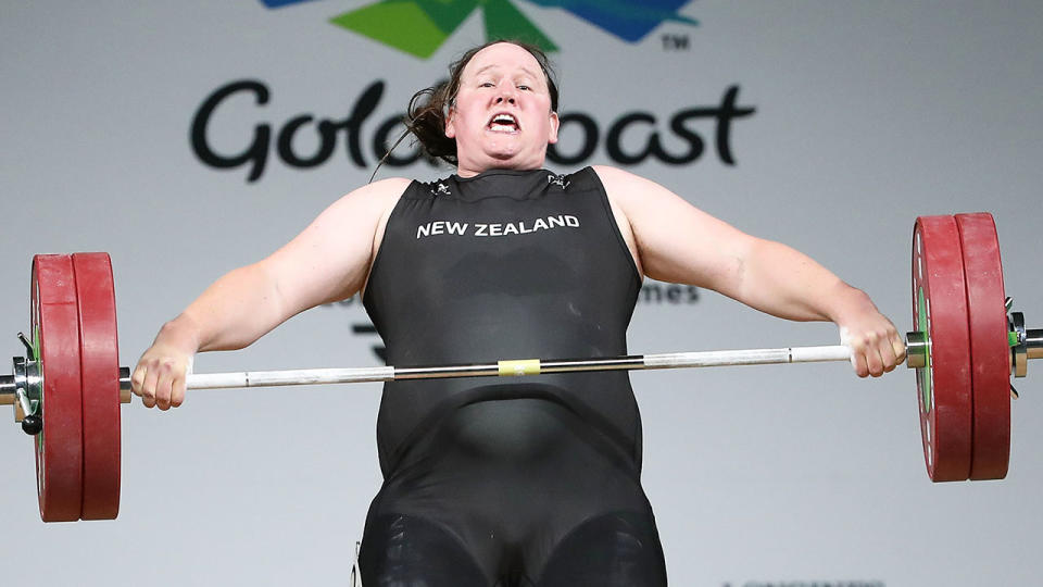 Seen here, transgender weightlifter Laurel Hubbard strains to lift a bar in competition.