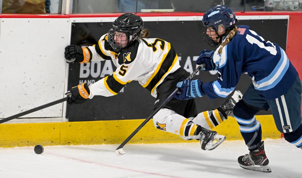 Darby Rounseville of Sandwich is called for a penalty after checking Gaby Bassett of Nauset in the sweet 16 girls hockey match.