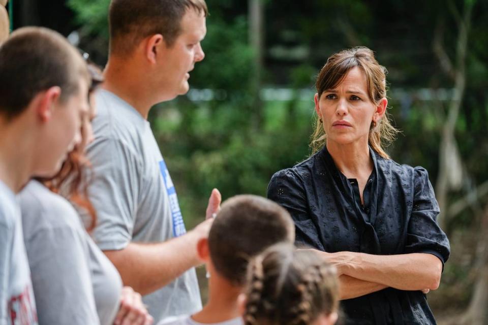 Actor and Save the Children Trustee Jennifer Garner, right, speaks to a family impacted by the flooding in East Perry County on Sunday, Aug. 7, during her visit to Kentucky to help children and families impacted by the flooding.