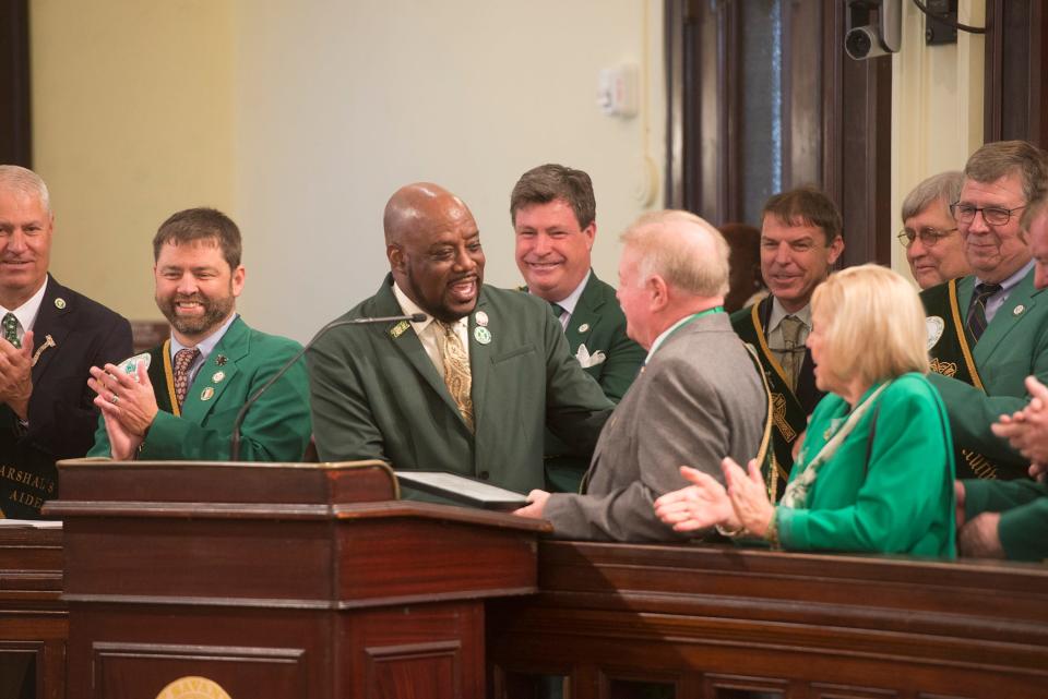 Savannah Mayor Van Johnson presents St. Patrick's Day Parade Committee Grand Marshal George Schwarz III with a permit for the 2023 St. Patrick's Day Parade at the March 8 council meeting.