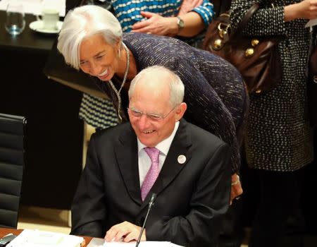 FILE PHOTO: German Finance Minister Wolfgang Schaeuble talks to IMF Managing Director Christine Lagarde during the G20 Finance Ministers and Central Bank Governors Meeting in Baden-Baden, Germany, March 17, 2017. REUTERS/Kai Pfaffenbach/File Photo