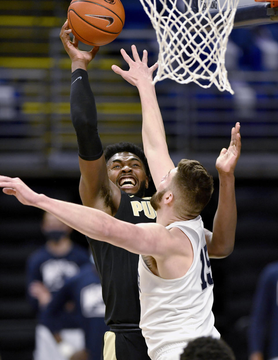 Purdue's Trevion Williams shoots over Penn State's Trent Buttrick during an NCAA college basketball game Friday, Feb. 26, 2021, in State College, Pa. (Abby Drey/Centre Daily Times via AP)