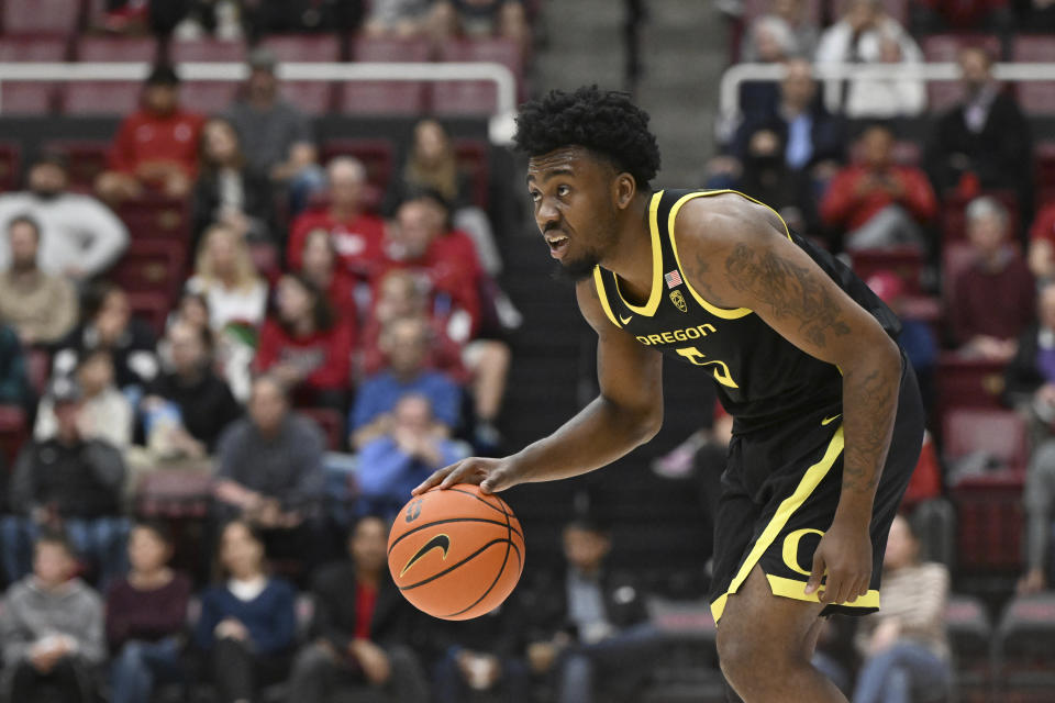 Oregon guard Jermaine Couisnard dribbles the ball during the second half of the team's NCAA college basketball game against Stanford on Thursday, Feb. 22, 2024, in Stanford, Calif. (AP Photo/Nic Coury)