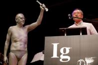 Atsugi Higashiyama of Japan accepts the 2016 Ig Nobel Prize in Perception for "investigating whether things look different when you bend over and view them between your legs" during the 26th First Annual Ig Nobel Prize ceremony at Harvard University in Cambridge, Massachusetts, U.S. September 22, 2016. REUTERS/Brian Snyder