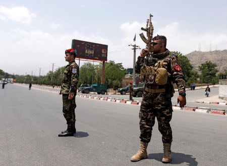 Afghan security forces keep watch at the site of a suicide attack in Kabul, Afghanistan June 4, 2018. REUTERS/Omar Sobhani