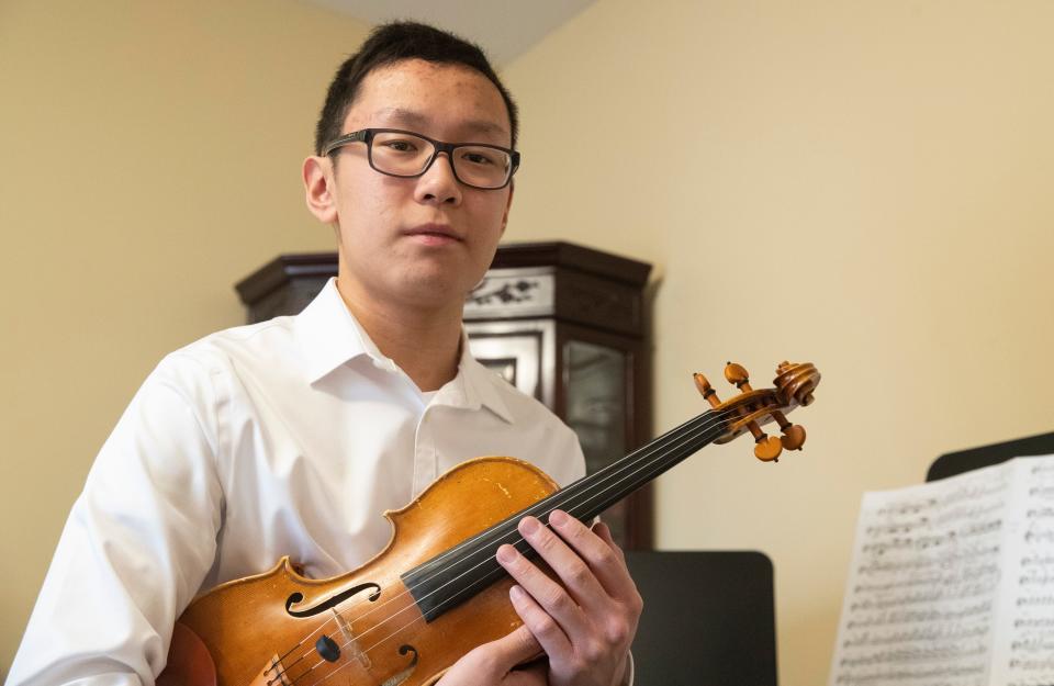 Aaron Du will be playing violin in Lafayette Symphony Orchestra this Saturday. Photo taken, Wednesday, March 29, 2023, in Lafayette, Ind. 