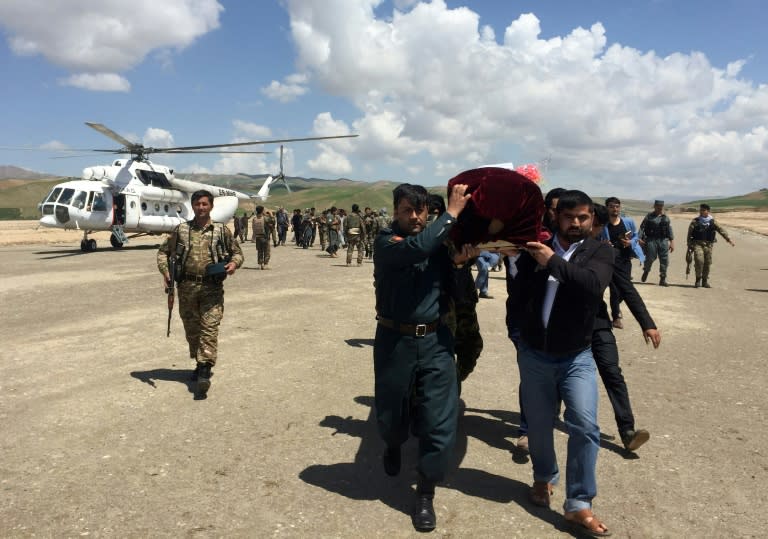 Relatives carry the coffin of a Afghan National Army soldier killed during a Taliban attack in Takhar Province. NATO will supply more troops following recent Taliban gains