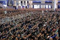 Iranian worshippers chant slogans during the Friday prayers sermon led by Iran's Supreme Leader Ayatollah Ali Khamenei, in Tehran