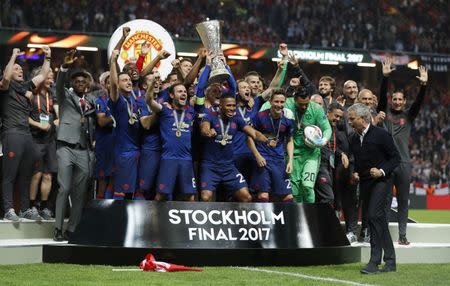 Football Soccer - Ajax Amsterdam v Manchester United - UEFA Europa League Final - Friends Arena, Solna, Stockholm, Sweden - 24/5/17 Manchester United celebrate winning the Europa League with the trophy Reuters / Andrew Couldridge Livepic