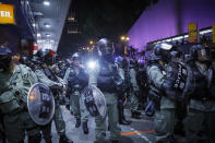 Riot Police petrol with face mask in the Tsim Sha Tsui district in Hong Kong, Thursday, Oct. 10, 2019. A Hong Kong government official said on Thursday that Apple was responsible for removing a smartphone application which allowed activists to report police movements. (AP Photo/Kin Cheung)