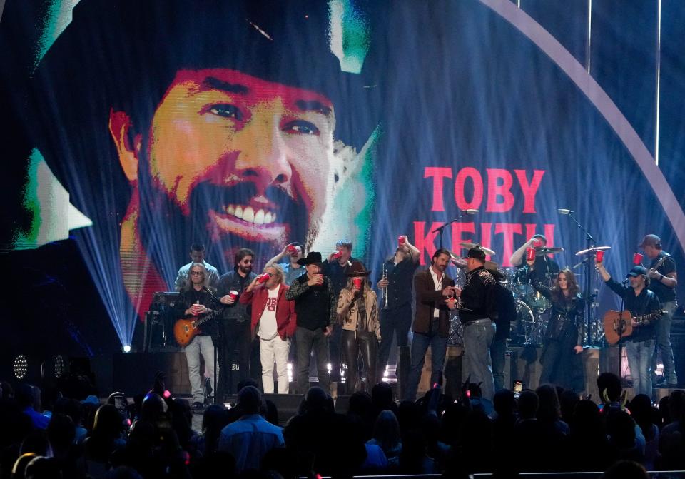 Performers including Sammy Hagar, Brooks & Dunn, Lainey Wilson and baseball Hall of Fame pitcher Roger Clemens salute the late Toby Keith's memory on April 7 at the 2024 CMT Music Awards at the Moody Center in Austin, Texas.