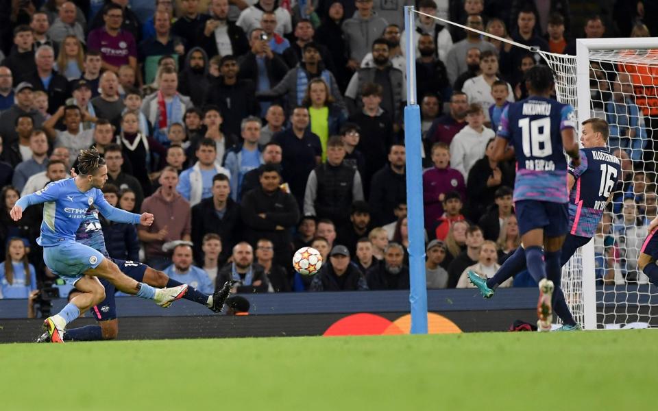 Jack Grealish of Manchester City scores his team's fourth goal during the UEFA Champions League group A match between Manchester City and RB Leipzig  - Vincent Mignott/DeFodi Images via Getty Images