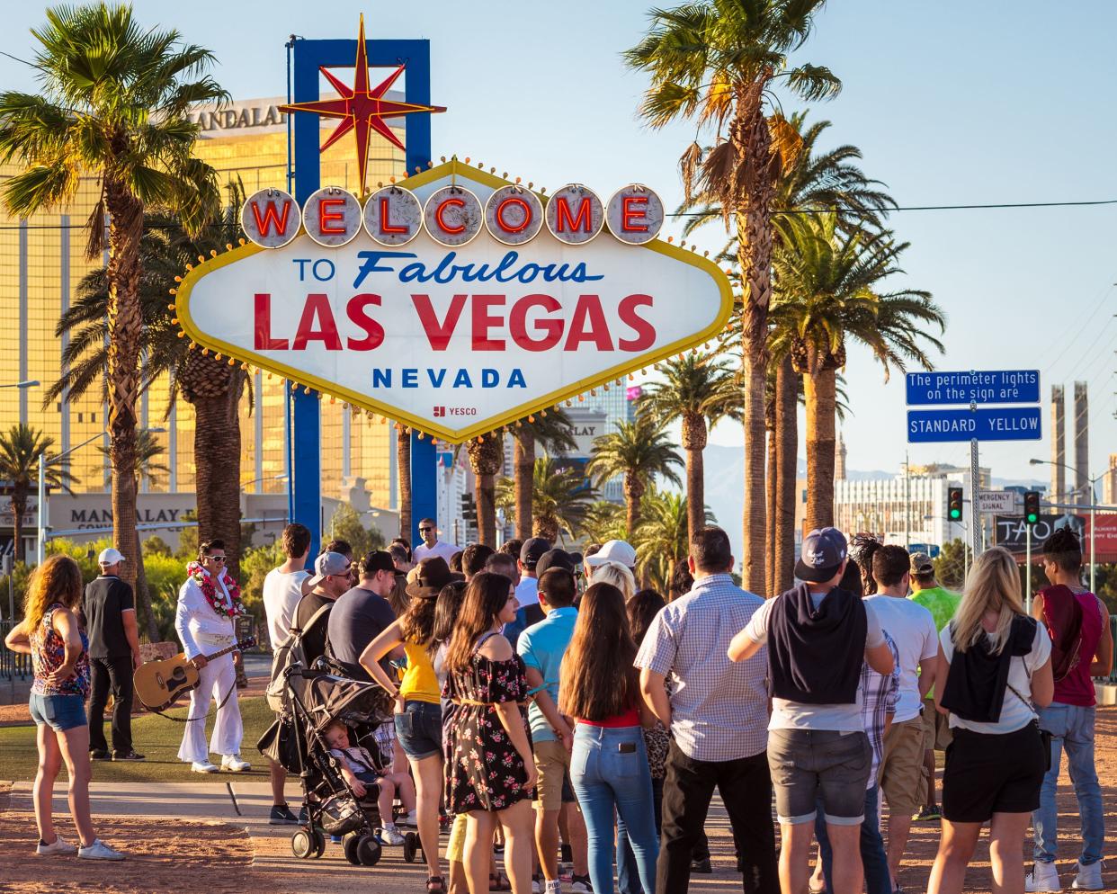 crowds in front of the iconic 'Welcome to Fabulous Las Vegas' sign