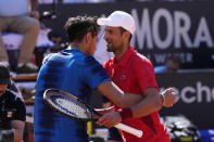 Serbia's Novak Djokovic, right, hugs Chile's Alejandro Tabilo after their match at the Italian Open tennis tournament in Rome, Sunday, May 12, 2024. (AP Photo/Alessandra Tarantino)