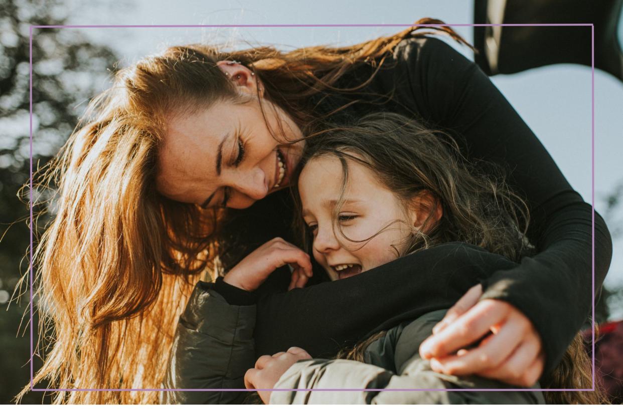  Parenting styles illustrated by parent and child laughing. 