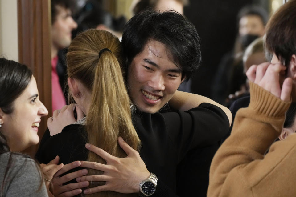 Pianist Bruce (Xiaoyu) Liu, center, of Canada celebrates after being named as the winner of the 40,000-euro ($45,000) first prize in the 18th Frederic Chopin international piano competition, a prestigious event that launches pianists’ world careers, at the National Philharmonic in Warsaw, Poland, on Thursday, Oct. 21, 2021. Almost 90 pianists from around the globe took part in the 18th edition of the competition that was postponed from 2020 due to the pandemic. (AP Photo/Czarek Sokolowski)