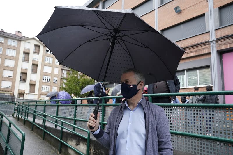 Basque premier Inigo Urkullu leaves a polling station after voting during the Basque regional elections, amid the coronavirus disease (COVID-19) outbreak, in Durango