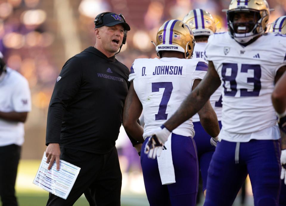 Oct 28, 2023; Stanford, California, USA; Washington Huskies head coach Kalen DeBoer congratulates his players after scoring a touchdown against the Stanford Cardinal during the first quarter at Stanford Stadium. Mandatory Credit: D. Ross Cameron-USA TODAY Sports